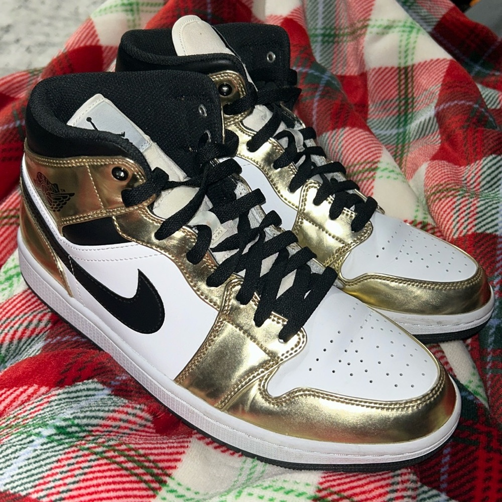 Gold and white Nike Air Jordans